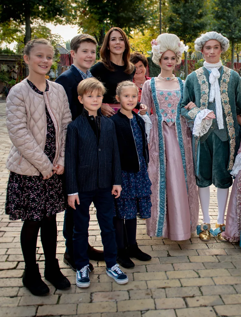 Princess Mary attends theatre with children while Prince Frederik plays golf