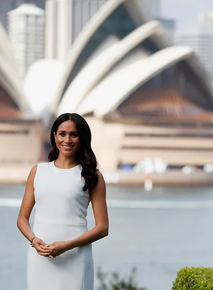 Pregnant Meghan Markle steps out in tight white dress