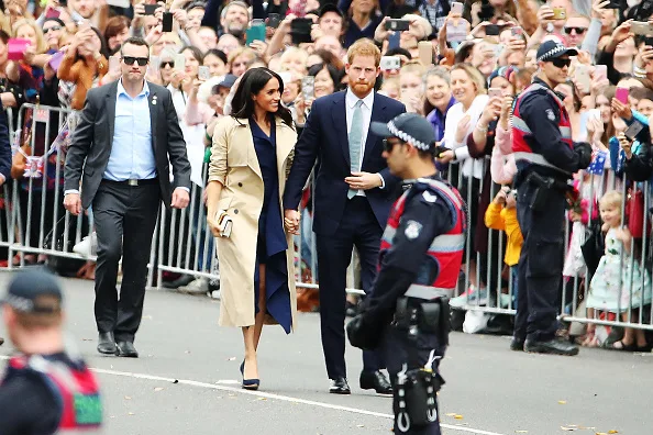 Meghan markle fashion wears blue dion lee dress in Melbourne