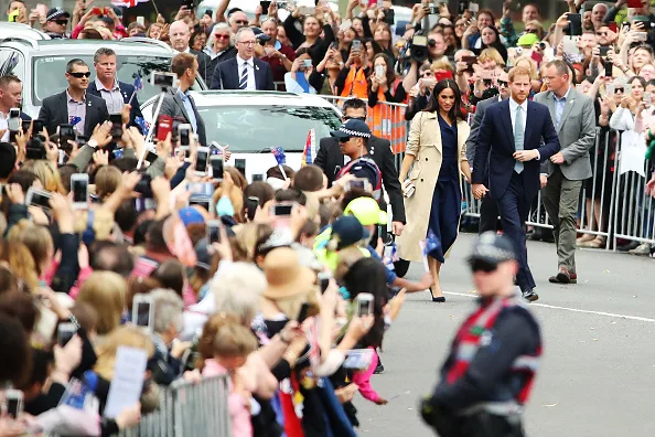 Meghan markle fashion wears blue dion lee dress in Melbourne