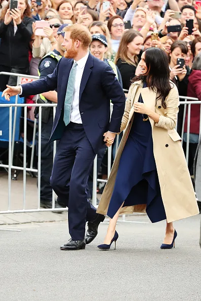 Meghan markle fashion wears blue dion lee dress in Melbourne