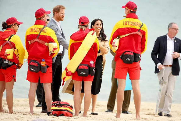 Meghan markle fashion black dress outfit change