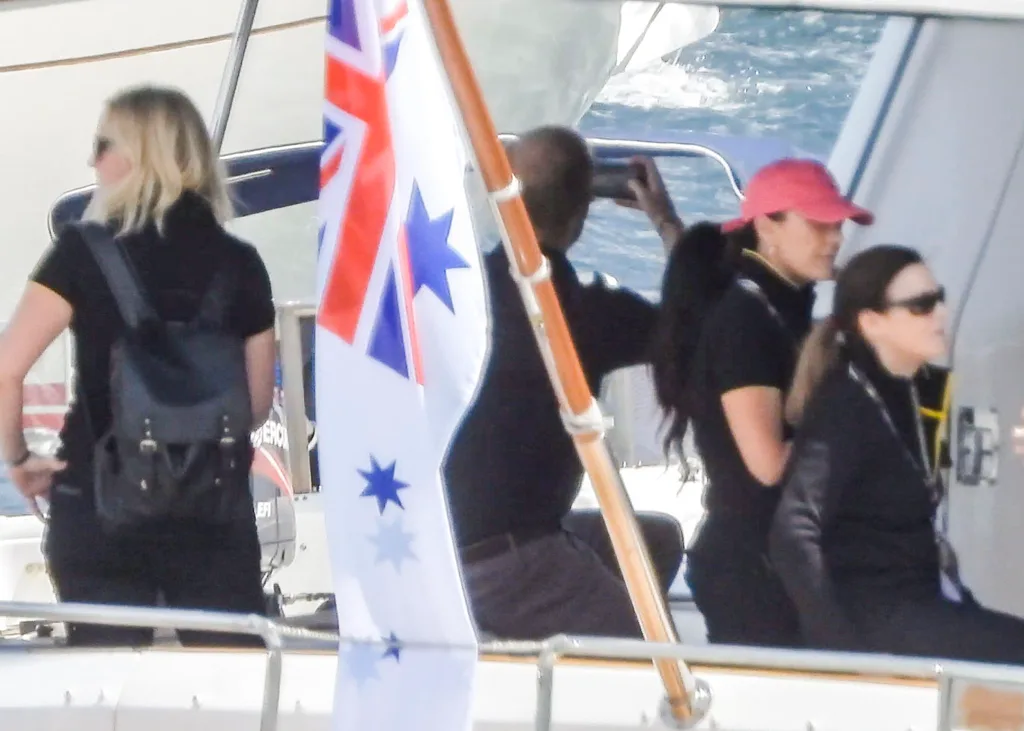 Prince harry takes iphone photos on boat sydney harbour