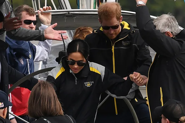 Caring prince harry holds meghan markle hand sailing sydneyCaring prince harry holds meghan markle hand sailing sydney