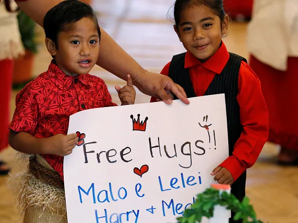 Meghan markle offered free hugs by adorable children