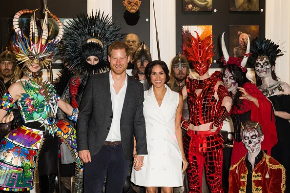 Duchess of Sussex Meghan Markle opted for a short white dress as she stepped out with Prince Harry in Wellington on Oct. 29. The royal couple attended a Halloween-themed event.