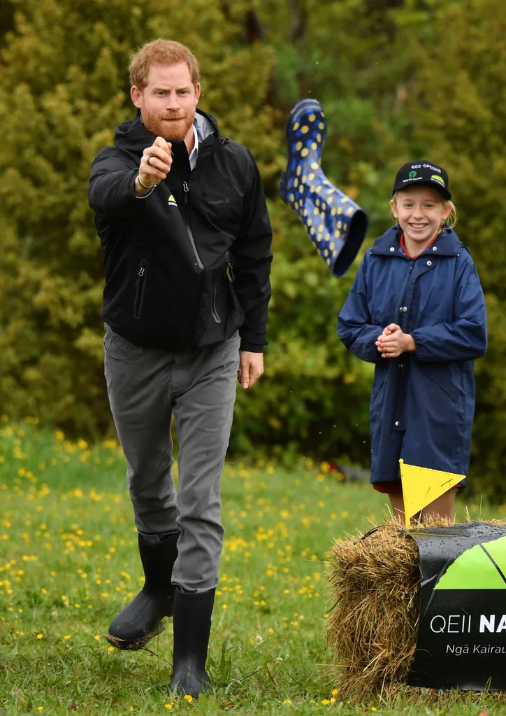Both Harry and Meghan tried their hand at welly-wanging along with the youngsters, with the duke’s boot landing closer to the target, but the duchess’s team winning overall.