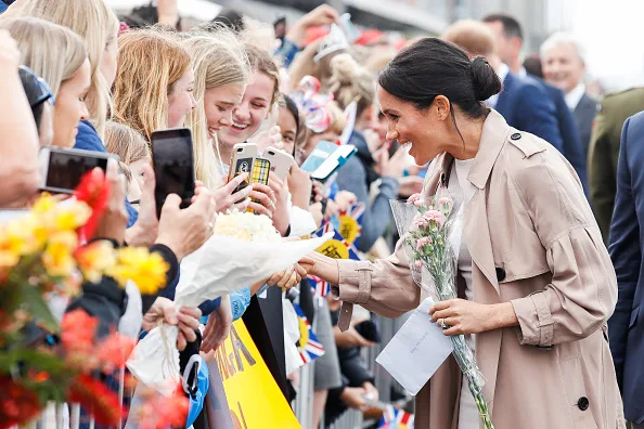 Meghan markle fashion wears white dress for walkabout