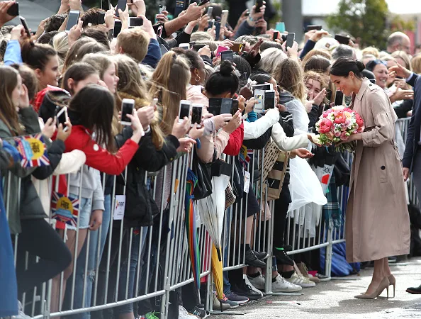Meghan markle fashion wears white dress for walkabout