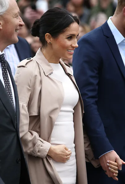 Meghan markle fashion wears white dress for walkabout