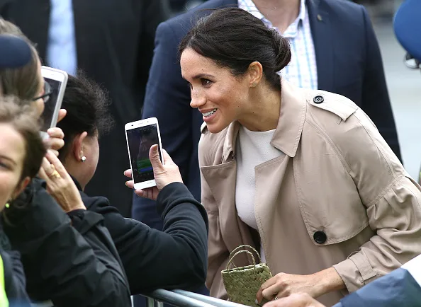 Meghan markle fashion wears white dress for walkabout