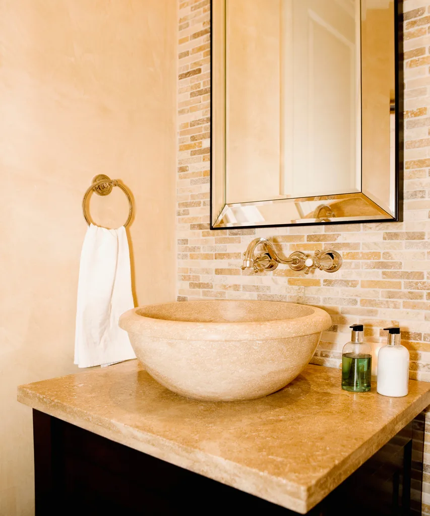 draw inspiration from the luxury of salons and spas by fitting a trough-style sink as the focal point of your bathroom.
