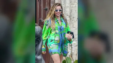 WATCH: Smiley Miley Cyrus makes statement in billowing shirt