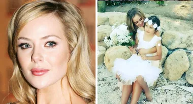 Jessica Marais beams in white as she poses with bouquet on beach