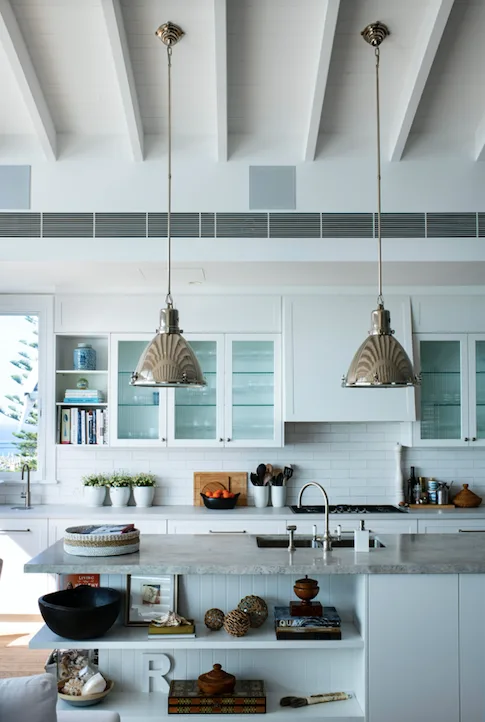 Ralph Lauren lights hang over the kitchen bench