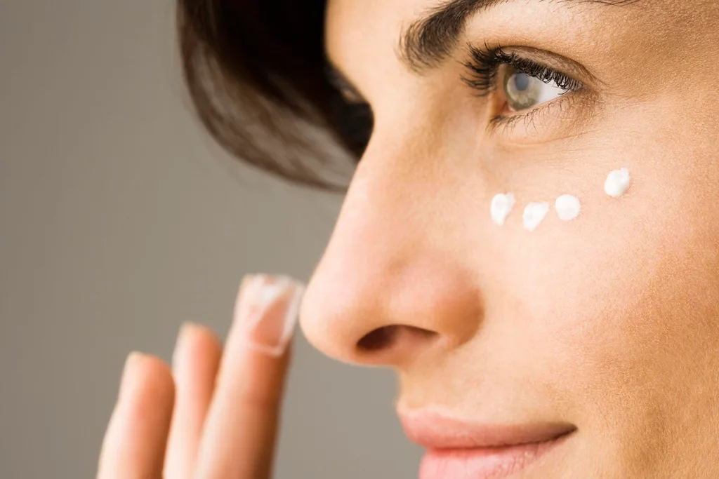 Woman applying makeup