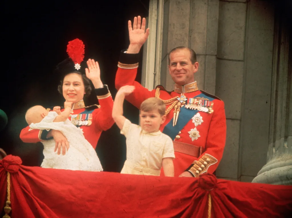Queen Elizabeth holds Prince Edward on the Palace balcony with Prince Phillip and Prince Andrew