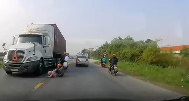 WATCH: Mum miraculously saves her son from oncoming truck with one heroic move