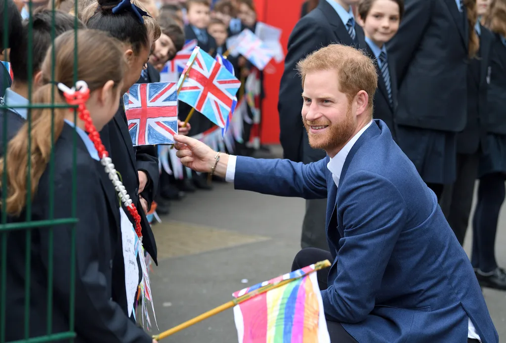 prince harry plays with puppy