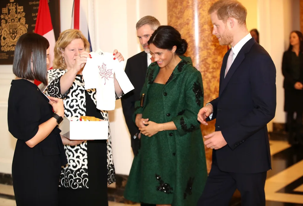 Meghan and Harry are presented with gifts for Baby Sussex