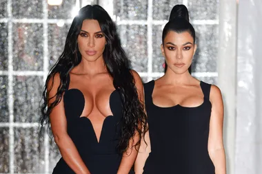 Kim and Kourtney Kardashian are proud mums as they pose for new photo