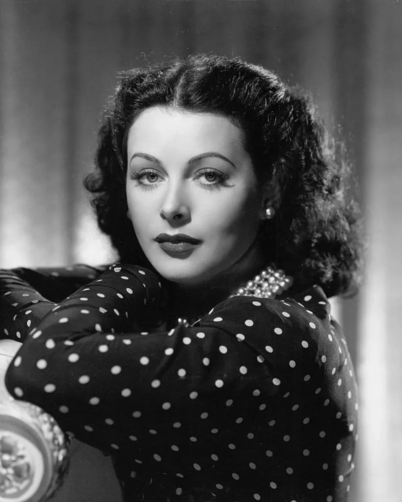 A black and white portrait of Hedy Lamarr