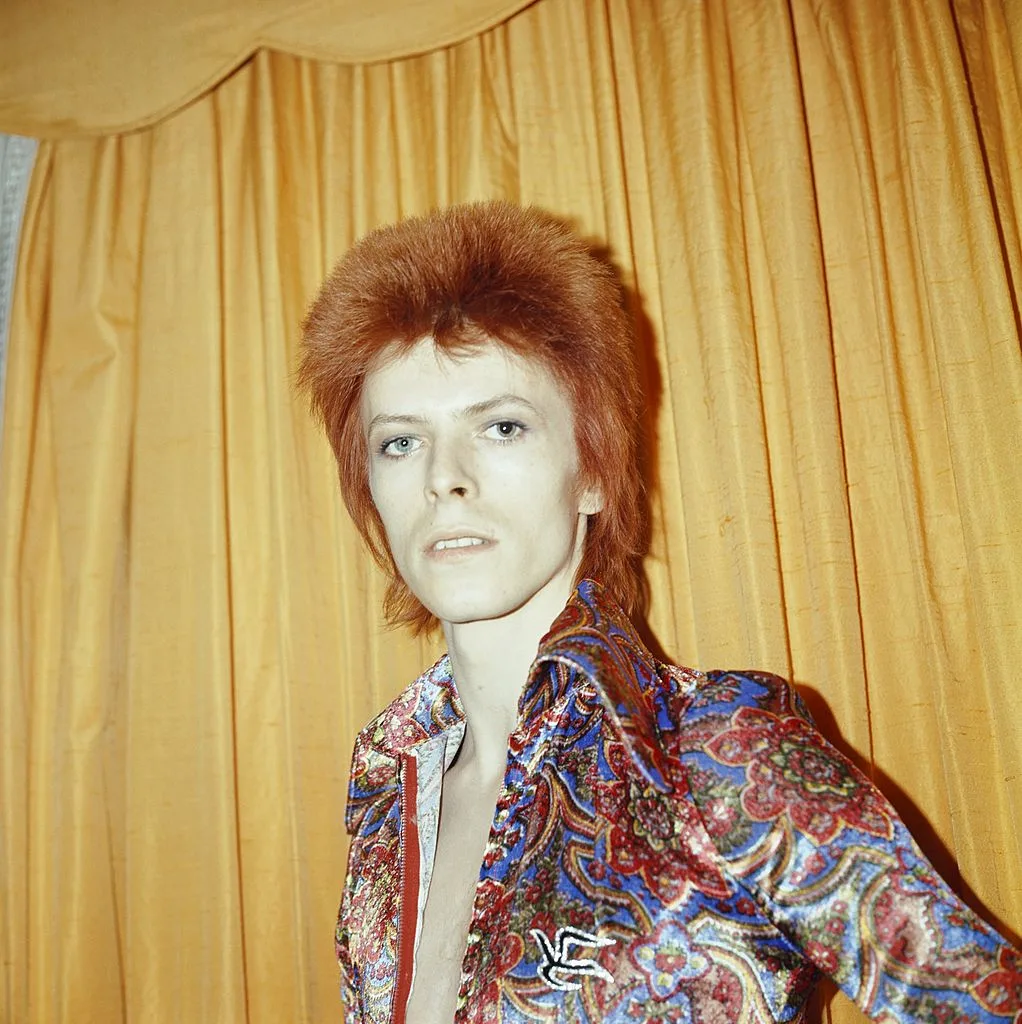 David Bowie dressed in a 70s glam rock outfit