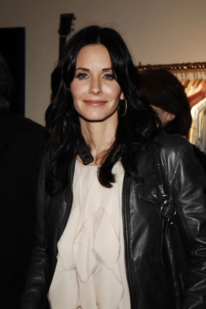 A portrait of Courteney Cox in a dressing room
