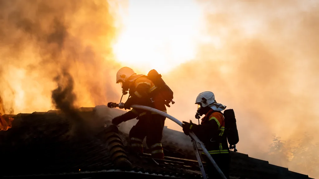 Firefighters fighting a house fire