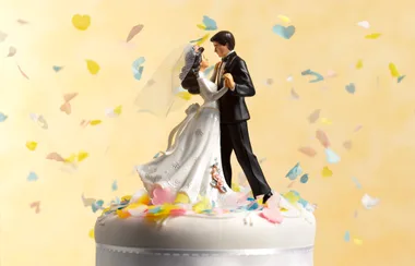 Figurines on top of a wedding cake
