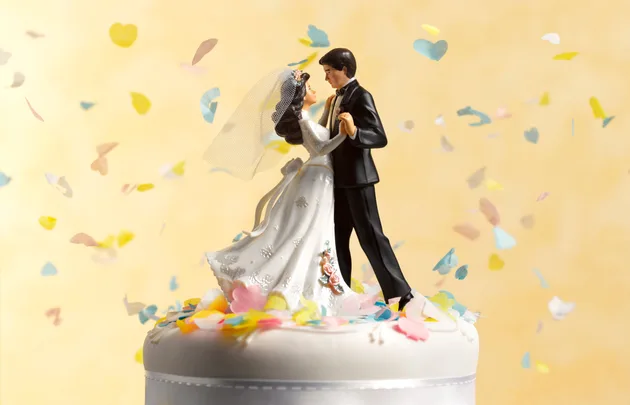 Figurines on top of a wedding cake