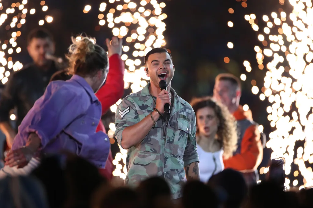 Guy Sebastian performing before the State of Origin.