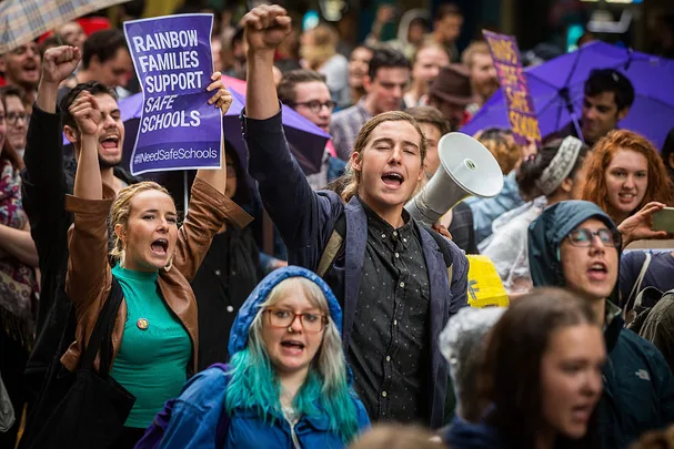 A group of protesters at a Hands Off Safe Schools rally