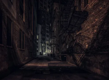 Abandoned alley with metal stairs