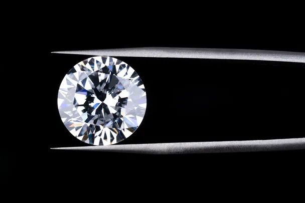 Diamond in between tweezers