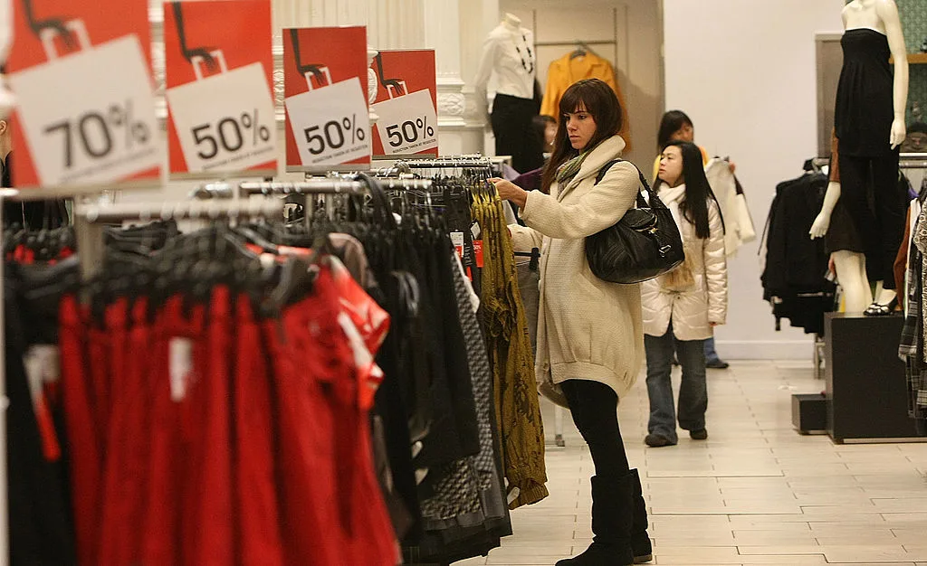 Woman looking at a sale rack at H&M
