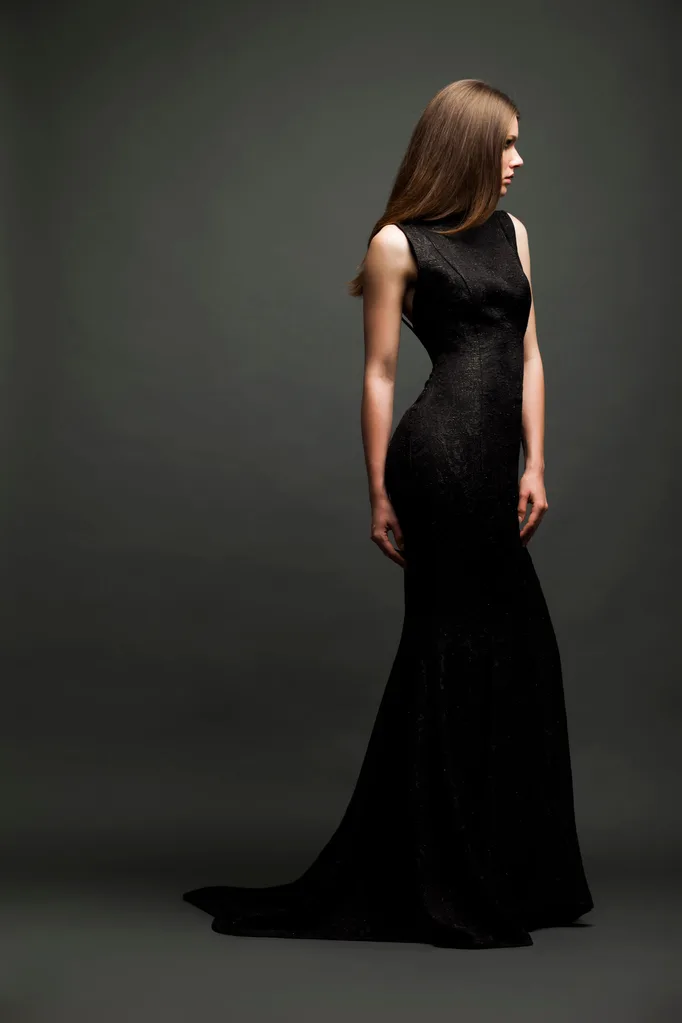 Woman wearing sleek, elegant black dress