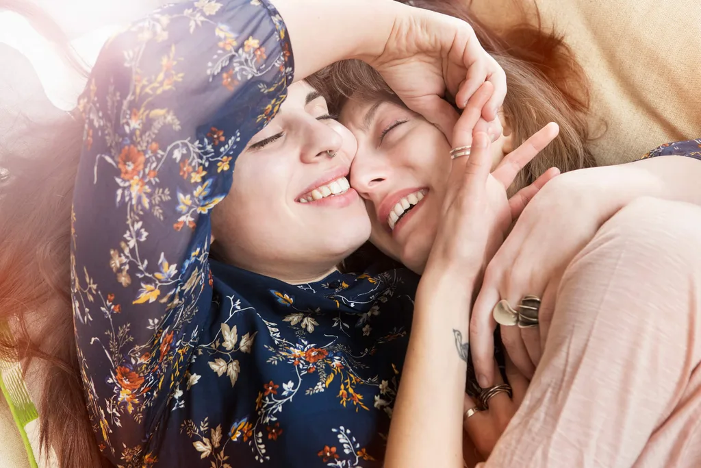 Two girls cuddling and smiling