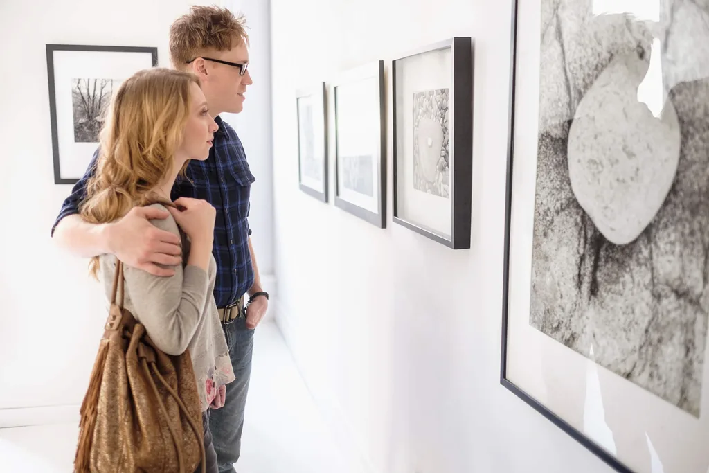 A young couple looking at art in a gallery
