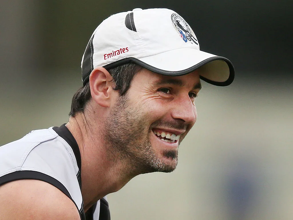 Collingwood Magpies player, Alan Didak, smiling in the club guernsey
