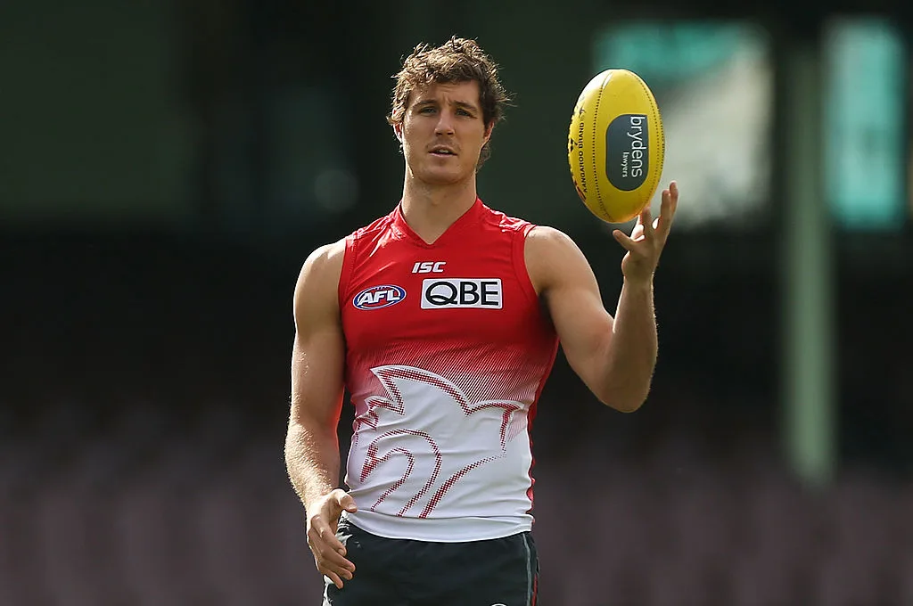 Sydney Swans player Kurt Tippett holding a football