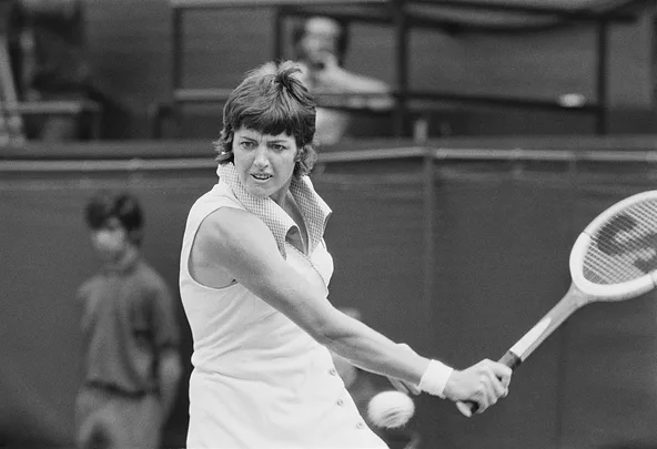 A black and white photo of Margaret Court on the tennis court