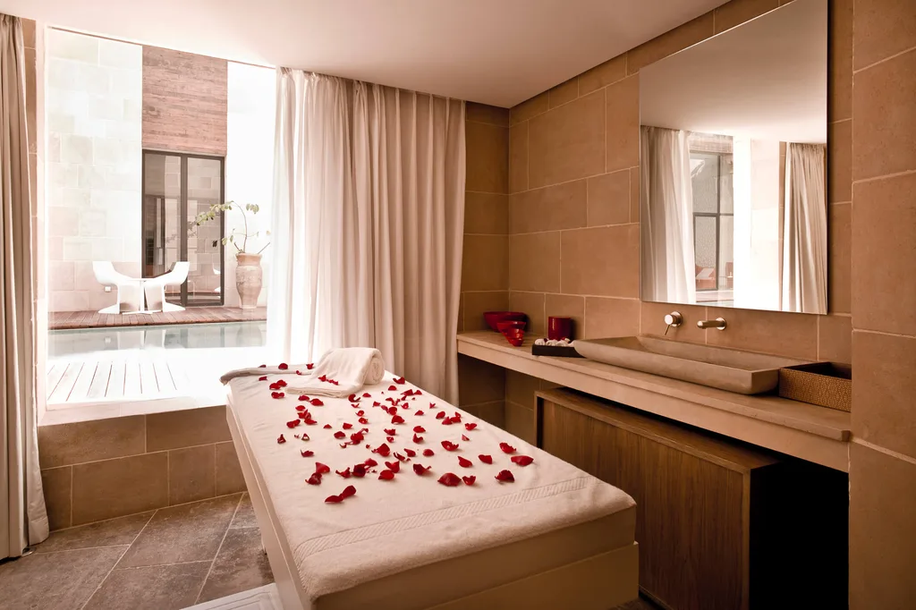 A boutique day spa with rose petals on a massage bed