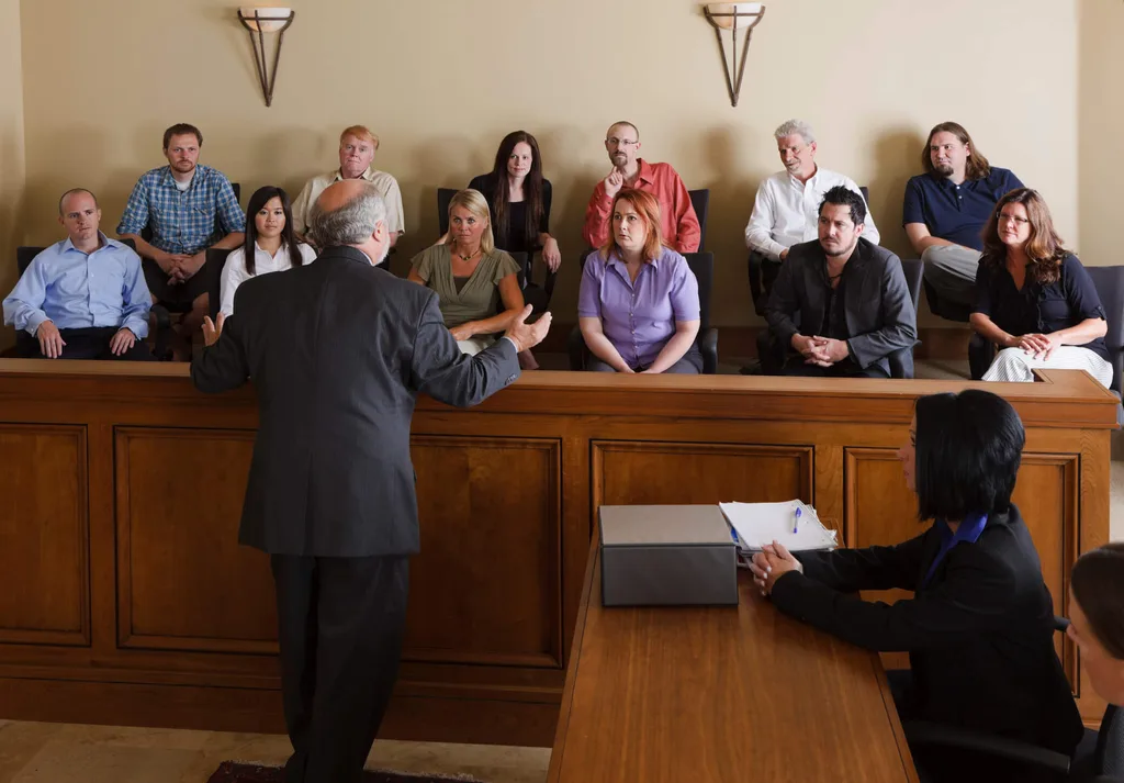 A lawyer pitching to a jury in a courtroom