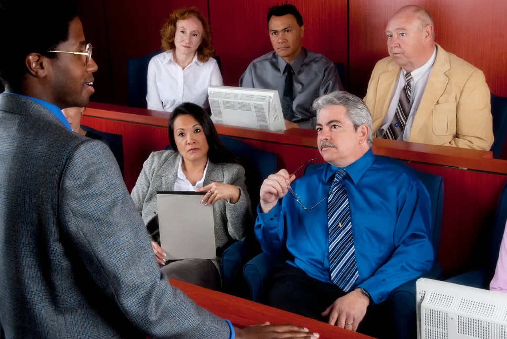 A jury looking at a lawyer