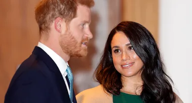 Prince Harry and Meghan Markle hold hands at emotional event