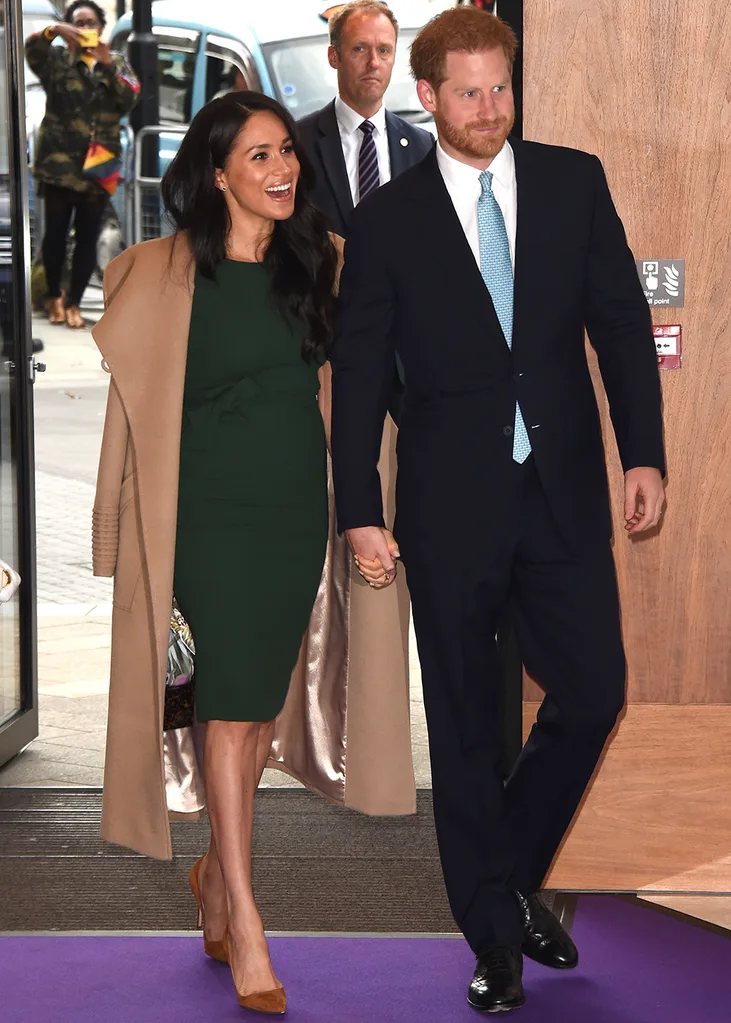 Prince Harry and Meghan Markle hold hands
