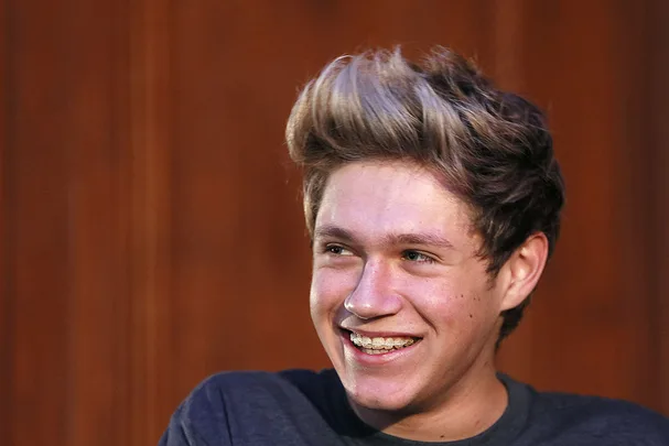 A portrait of Niall Horan smiling