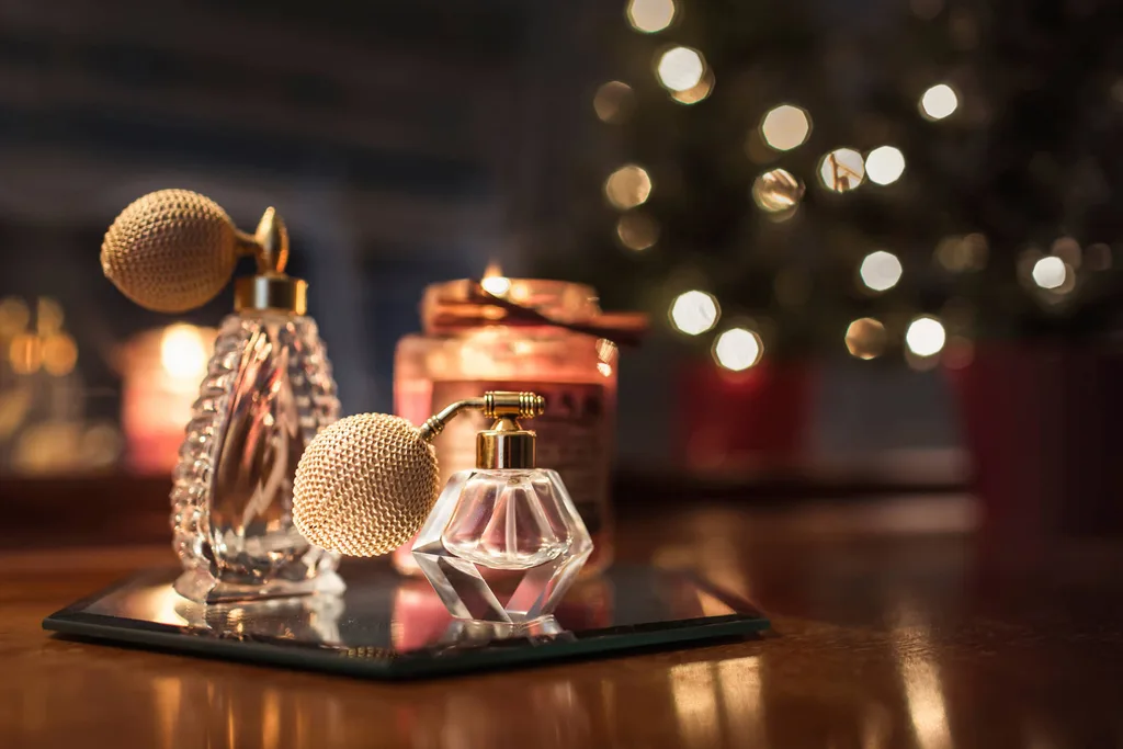 A spray bottle of perfume on a wooden table