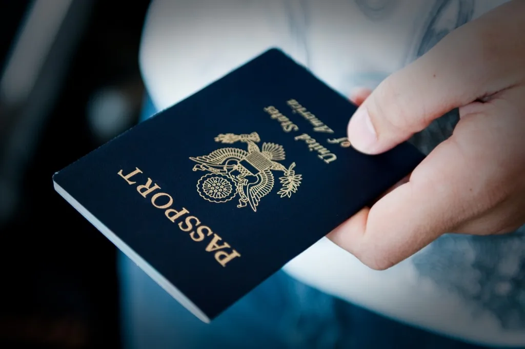 A man holding a US passport